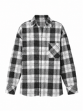 A long-sleeve button-up plaid shirt in black, gray, and white, featuring a chest pocket and a classic checkered pattern.